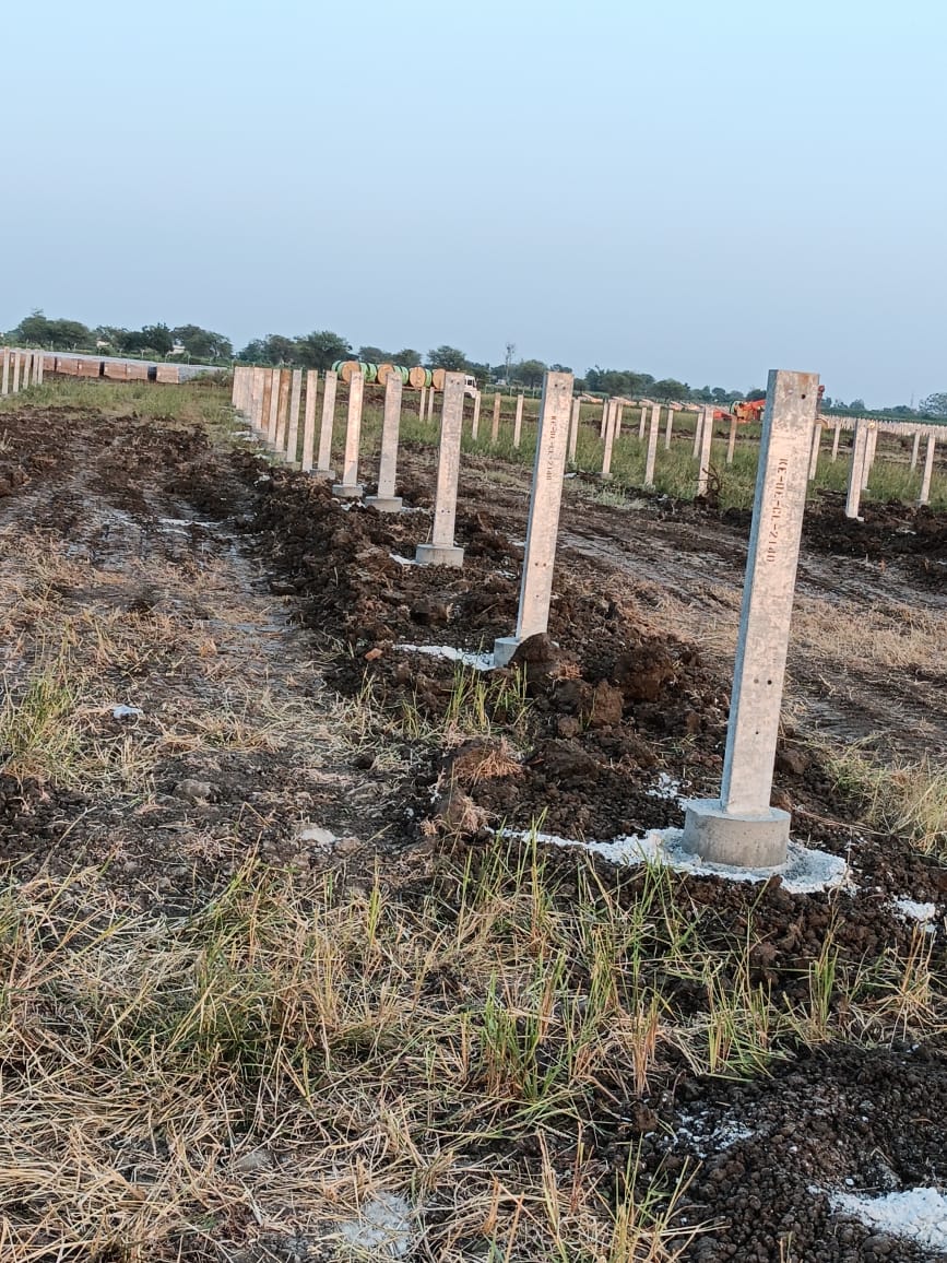 Precast concrete posts in position with excavated spoil alongside