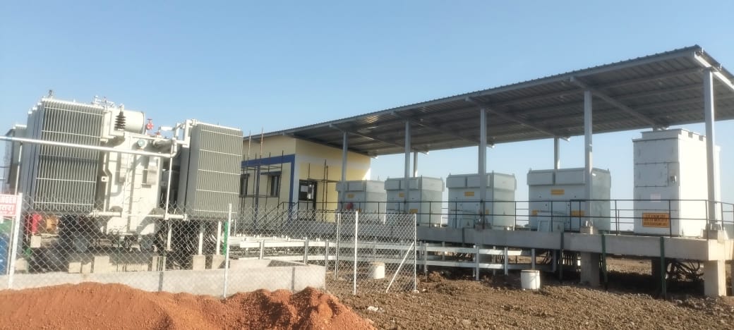 Transformer and inverter equipment installed under a canopy in the plant yard